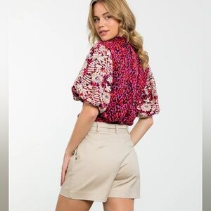 THML Blouse. Bold, colorful print with embroidered sleeves. Sz XS.
